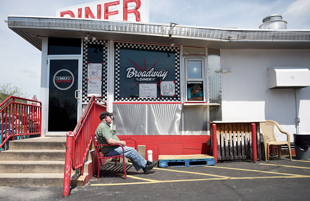 Ken Buckler talks to Broadway Diner owner Dave Johnson while waiting for his food